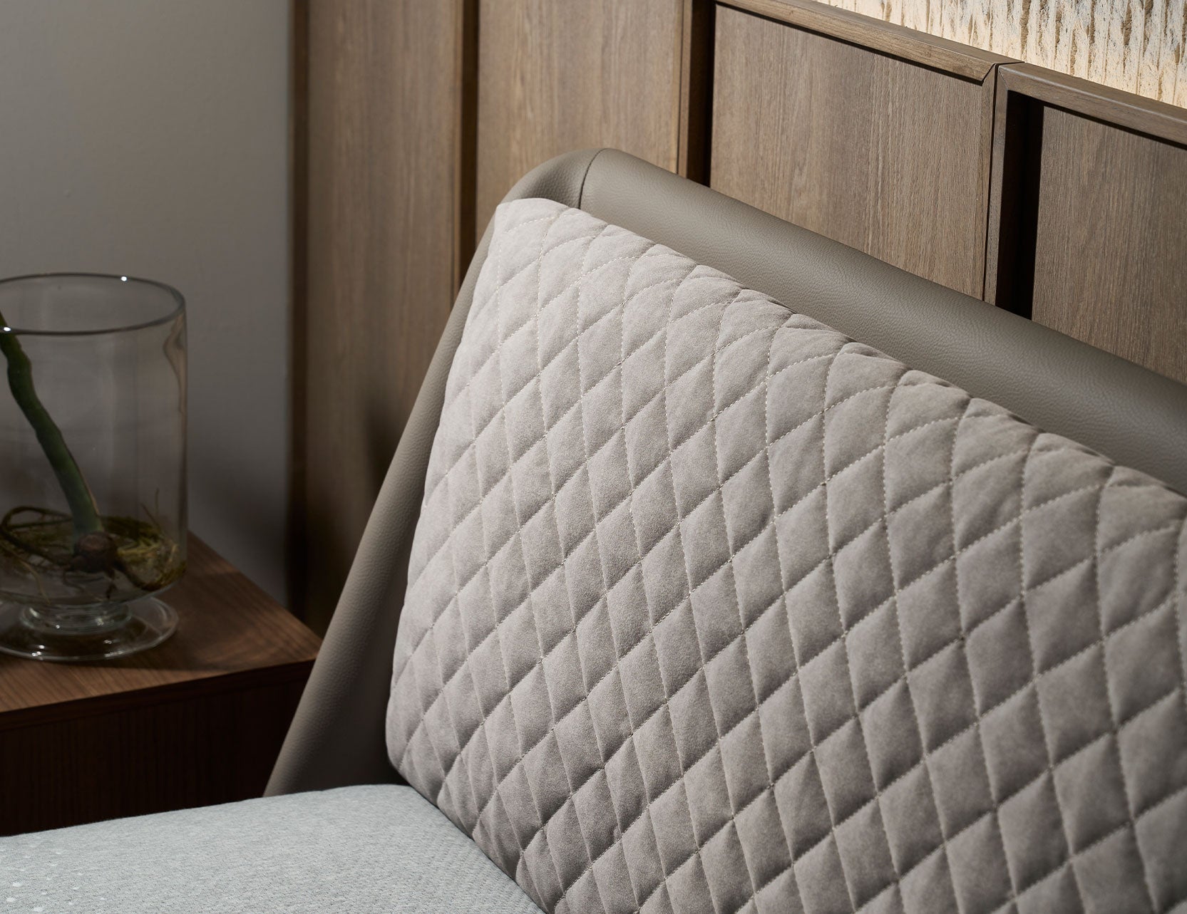Slanted bed frame with a supportive upholstered headboard