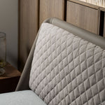 Slanted bed frame with a supportive upholstered headboard