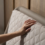 Slanted bed frame with cushioned headboard support