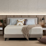 Slanted bed frame paired with mattress in a bedroom setting