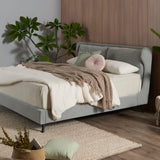 Winged bed frame with upholstered side panels