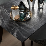 Black Beauty dining table close up showing surface detail