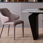 Hugg dining chair featuring a soft rounded backrest