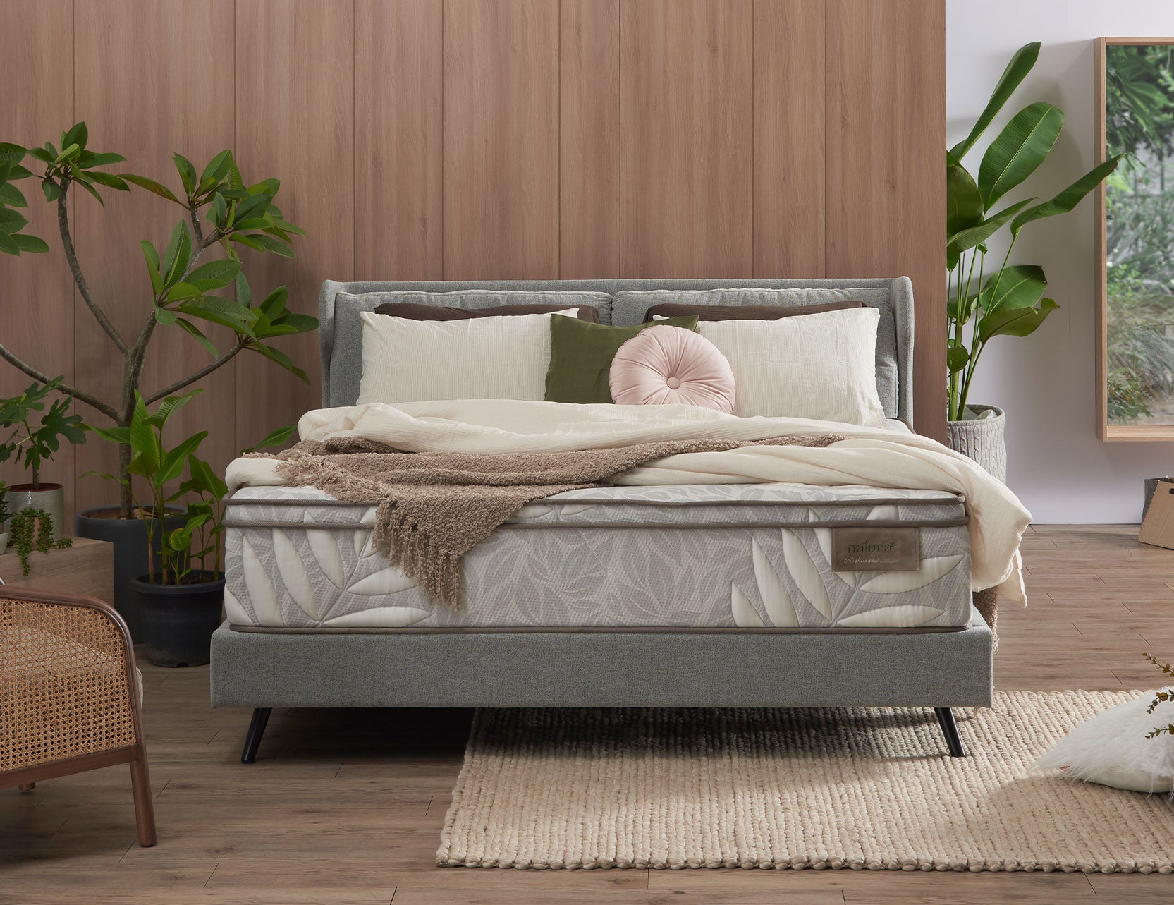 Natura bed frame styled in a calm bedroom setting