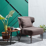 Wing fabric armchair with a bold sculptural form