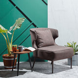 Wing fabric armchair with a bold sculptural form