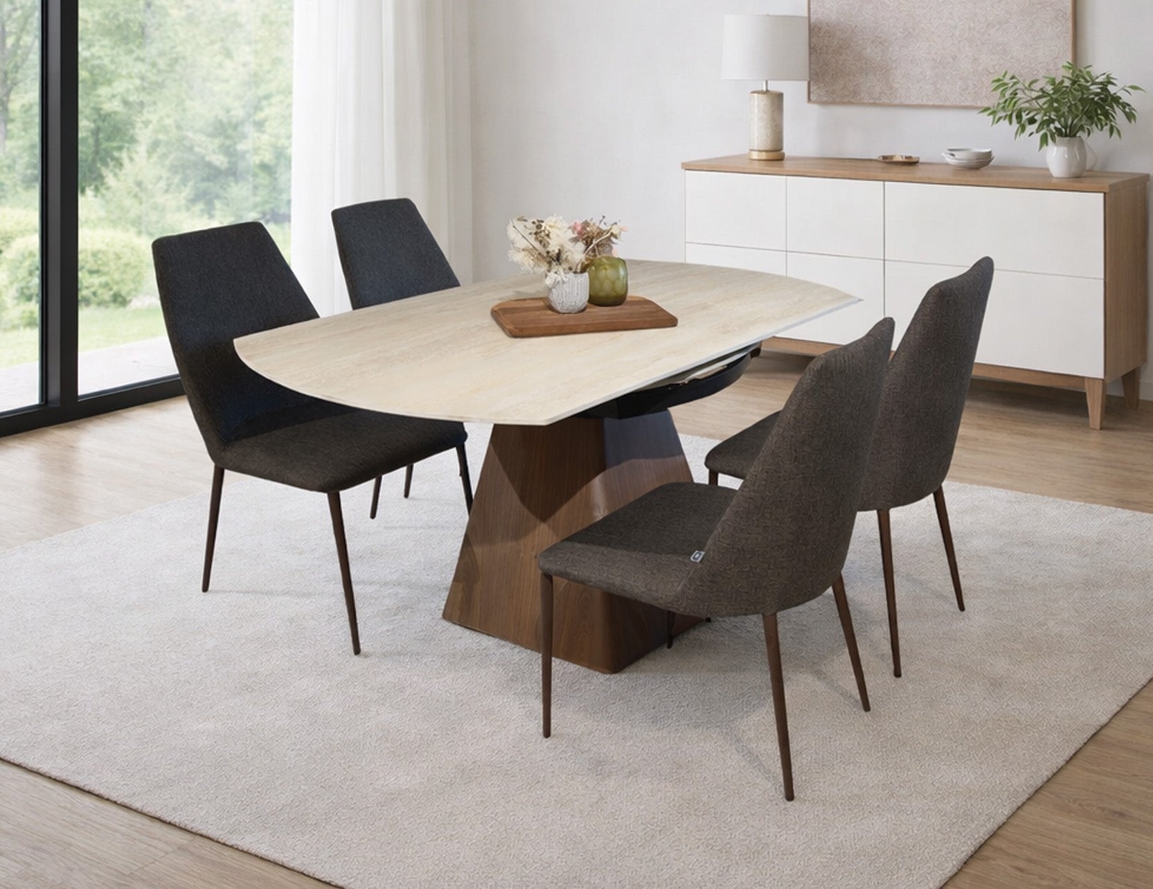 Travertine sintered stone top dining table with wooden base and upholstered dining chairs in modern interior