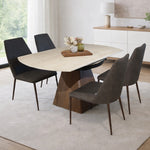Travertine sintered stone top dining table with wooden base and upholstered dining chairs in modern interior