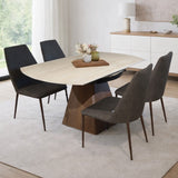 Travertine sintered stone top dining table with wooden base and upholstered dining chairs in modern interior
