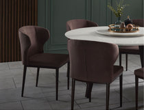 Wing dining chair featuring a bold sculptural design