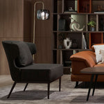 Wing fabric armchair shown from a side angle