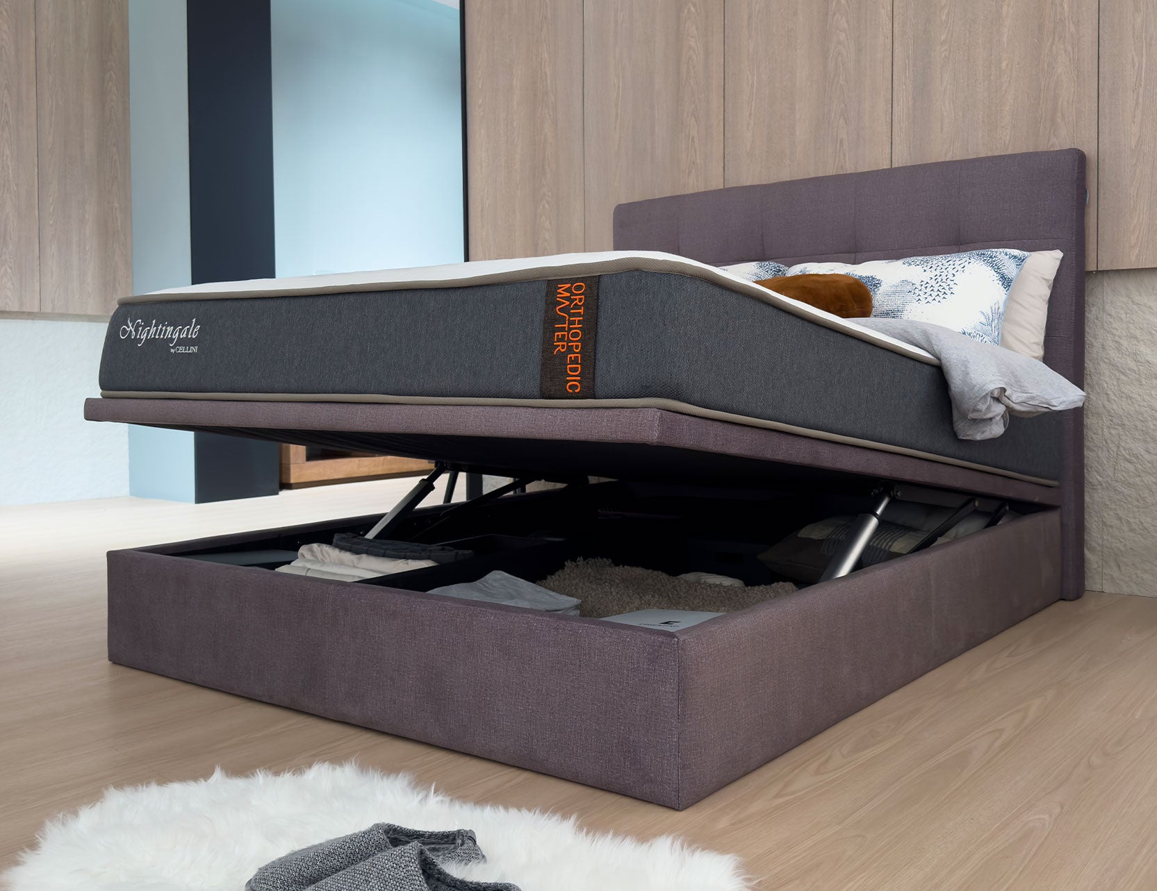 Storage bed frame shown with lift up compartment open
