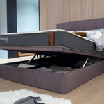 Storage bed frame shown with lift up compartment open