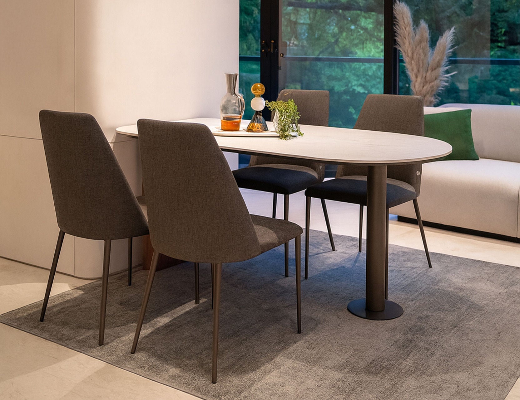 Capsule dining table paired with Henry chairs