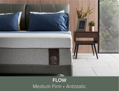 Flow mattress branding displayed on bed setup