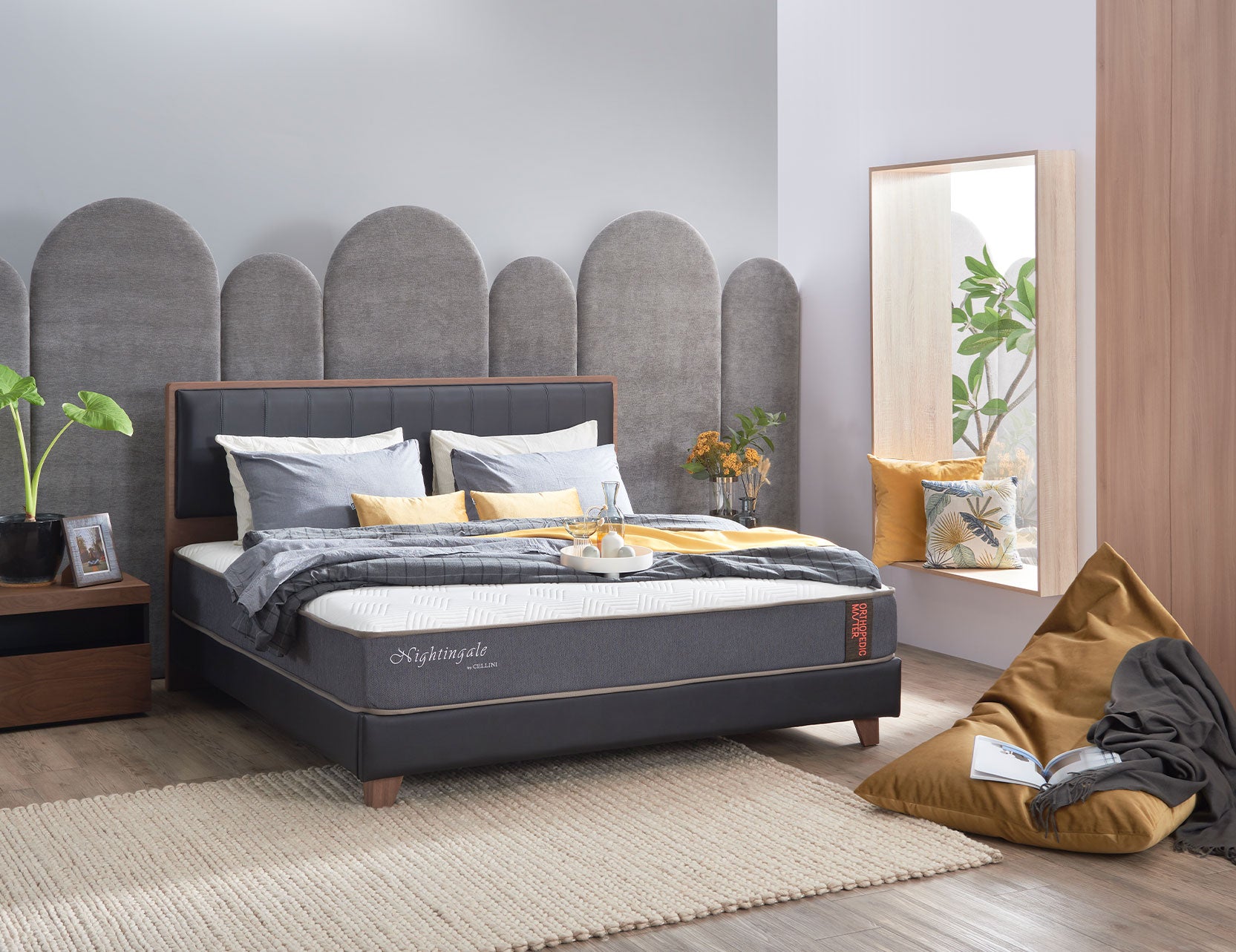 Orthopedic mattress displayed on a supportive bed base