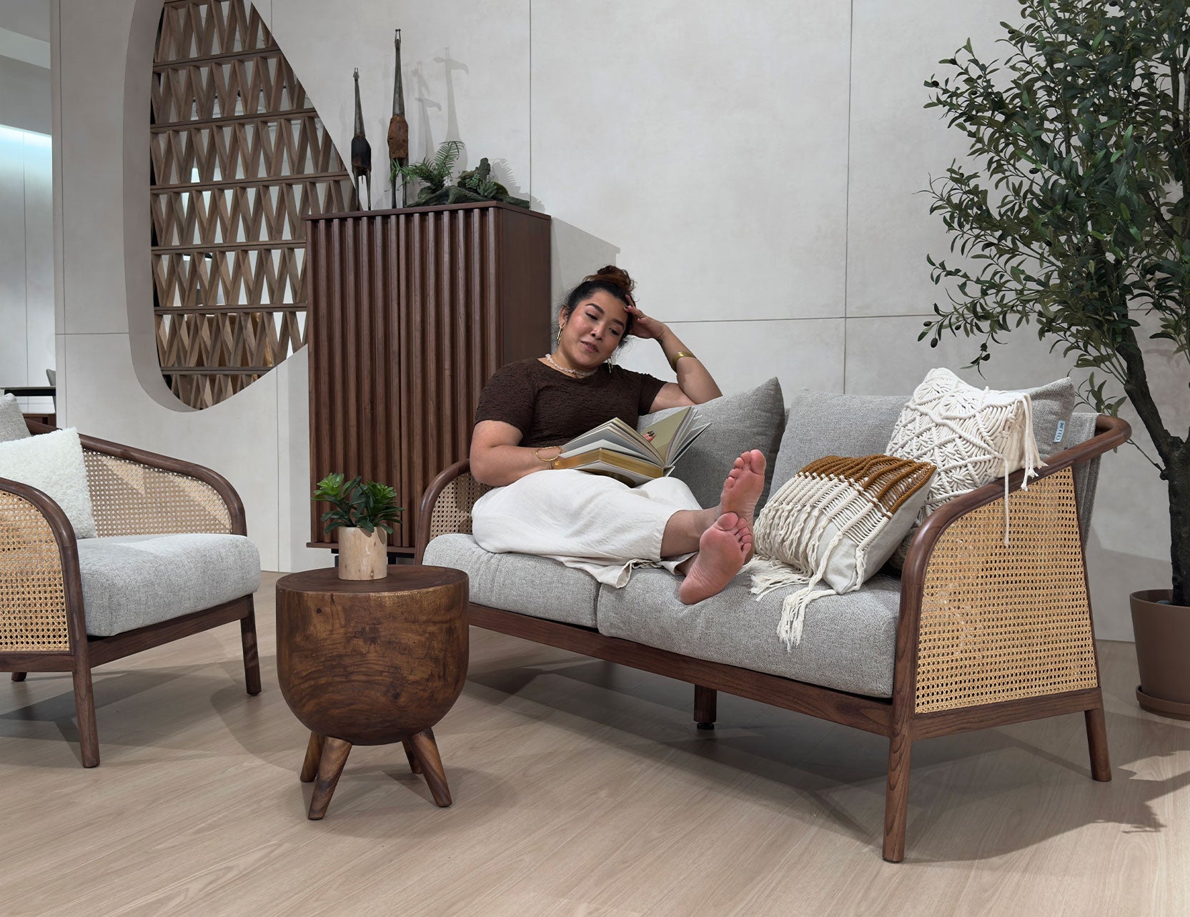 Nash fabric two seater sofa shown with model for scale