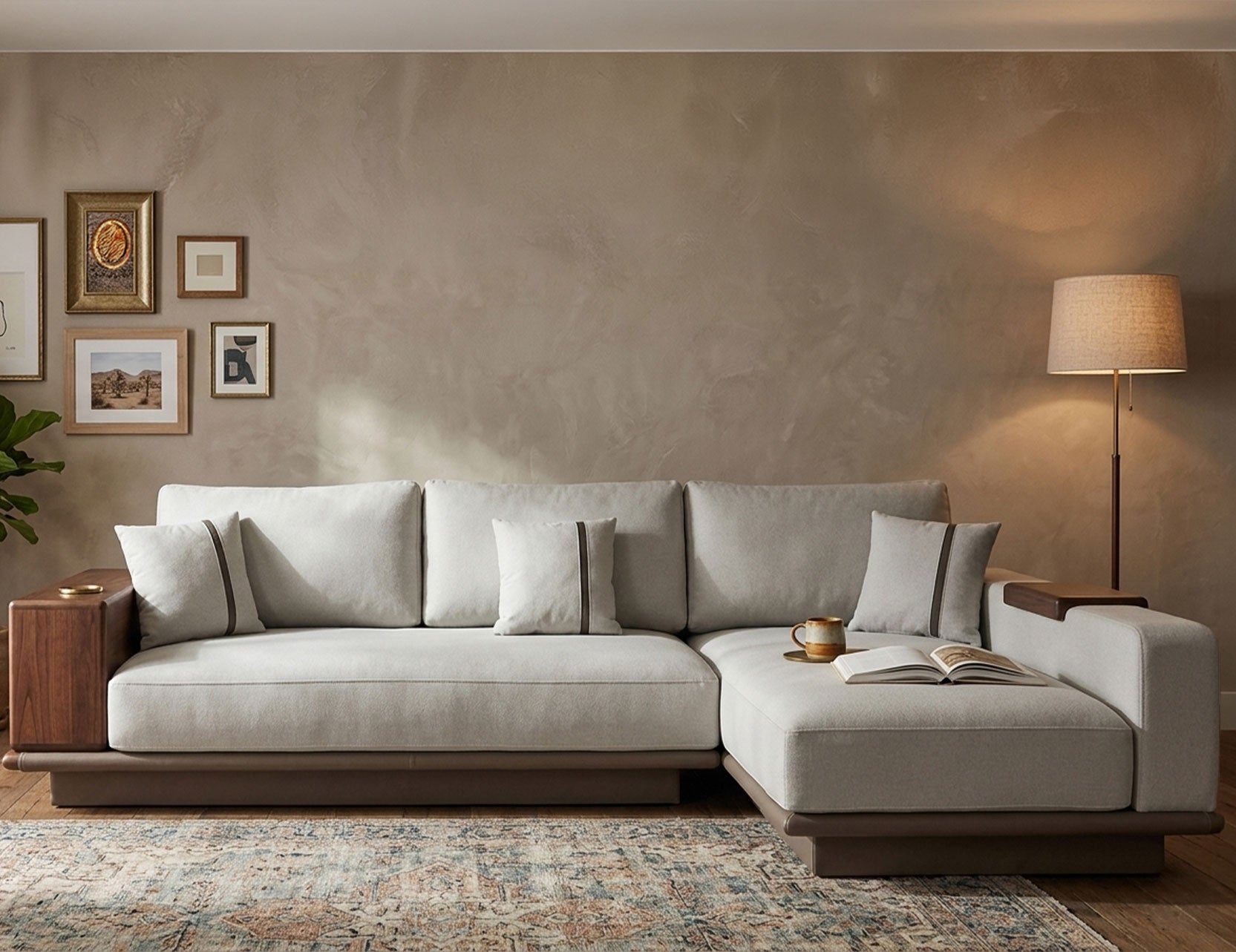 Japandi-inspired L-shaped sofa with built-in side shelf armrest in walnut wood, upholstered in light grey fabric with plush back cushions