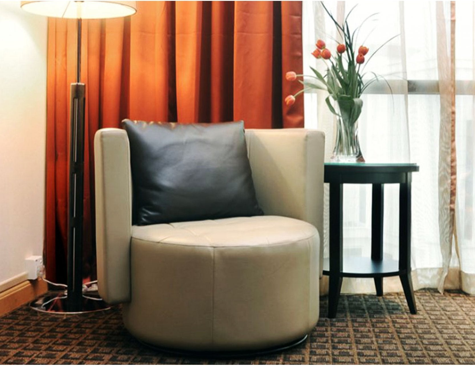Club lounge chair styled in a modern home office