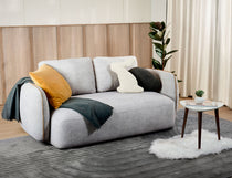 Rond fabric seater sofa shown in a cozy living space