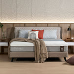 Slanted bed frame styled in a bedroom setting