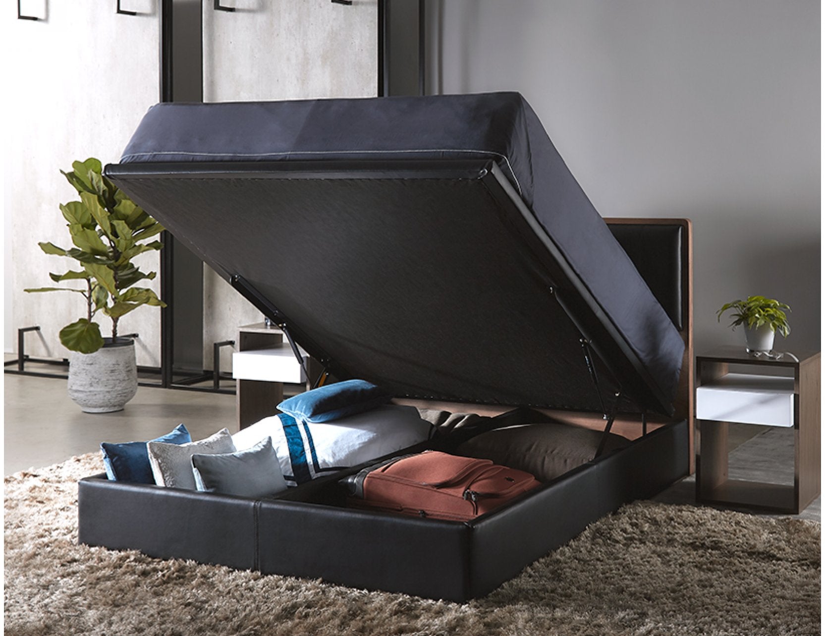 Trinity storage bed frame shown partially lifted